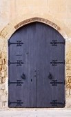 8524235 old gray wooden door in european town